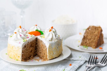 Carrot cake with icing and sprinkles at an Easter party