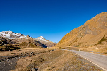 Obraz premium Road through the mountain landscape - Lukmanier Pass, Switzerland 