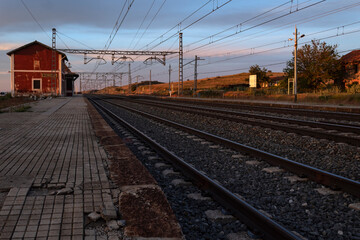 Fototapeta na wymiar Mingorria's unused railway station at the golden hour