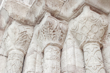 Closeup of stone columns, pilars of a medieval gothic church building in Coimbra town, Porugal,...