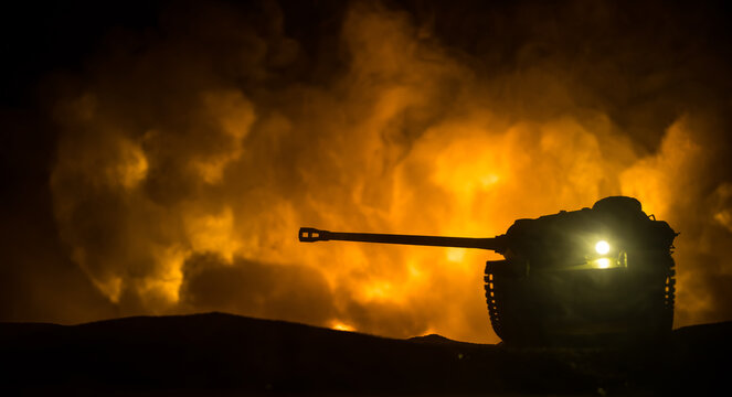War Concept. Military silhouettes fighting scene on war fog sky background, World War Soldiers Silhouette Below Cloudy Skyline At night. Battle in ruined city.