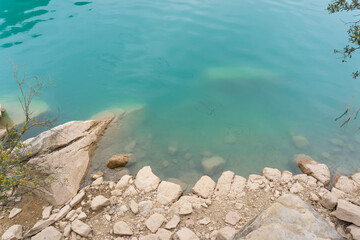 Rocky shore and crystal clear turquoise water