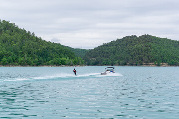 Fototapeta na wymiar Man practicing water skiing in the San Ponç reservoir