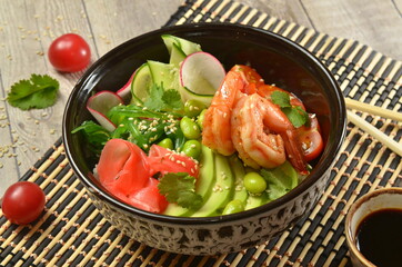 Asian healthuy food salad with tofu shrimps avocado and fresh vegetables