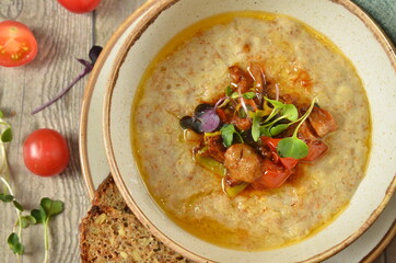 Kids breakfast oatmeal porridge with with butter - Image top view