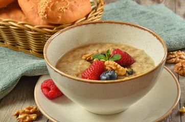 Kids breakfast oatmeal porridge with with butter - Image