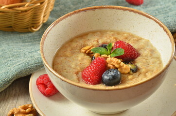 Kids breakfast oatmeal porridge with with butter - Image