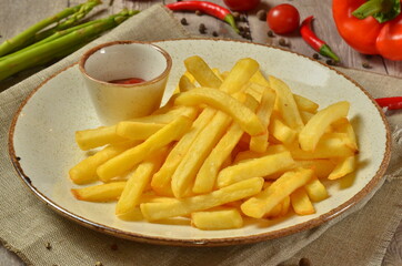 french fries on rustic wooden table background