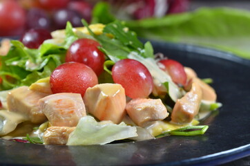Chicken and vegetable stew on black plate