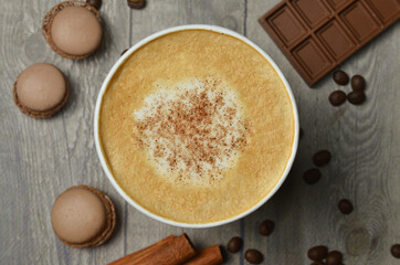 Top view of Latte hot coffee (or cappuccino) roasted coffee beans and ingredients on wooden table