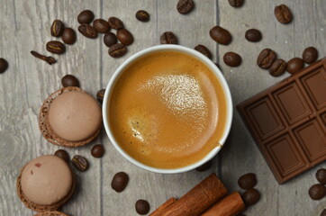 Top view of Latte hot coffee (or cappuccino) roasted coffee beans and ingredients on wooden table