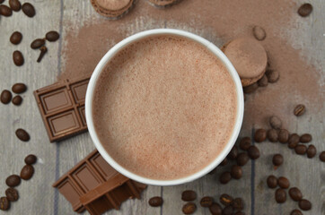 Top view of Latte hot coffee (or cappuccino) roasted coffee beans and ingredients on wooden table