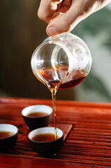 Tea master pouring tea ,Chinese tea ceremony.