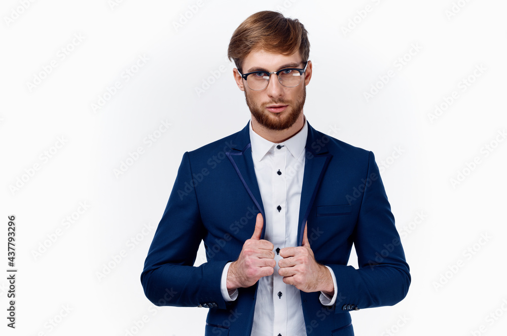 Wall mural businessman in classic suit showing thumb up Success at work light background