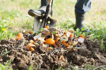 man digging and composting for sustainable living