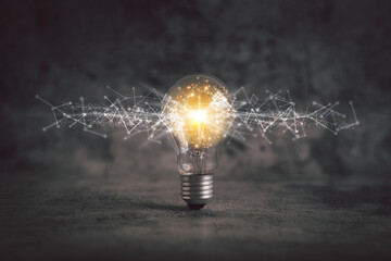 Glowing light bulb with futuristic icon . Self learning or education knowledge and business...
