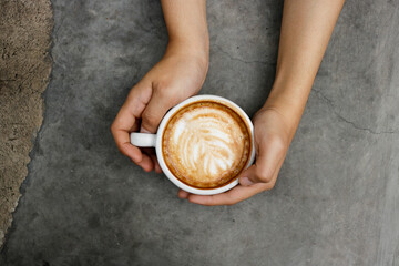person holding a cup of coffee