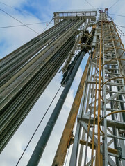 Drilling rig for drilling oil and gas. Inside view. There are drill plugs for lowering into the well. The unit is equipped with a top power drive