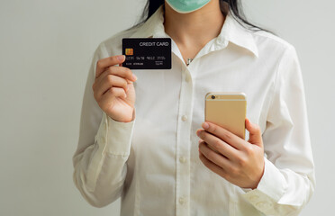 Close up woman hand using credit card and tablet for buying online shopping at home ,payment,buying and online shopping concept.