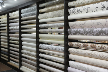 Assortment of stylish wall papers in shop