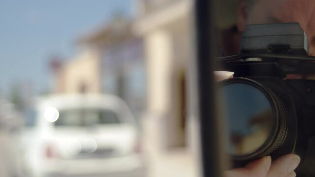 Hidden spy uses camera for surveillance as car passes in mirror, 4k, 60fps