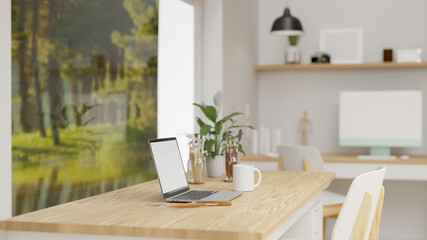 Office interior design with laptop, supplies and decorations on the table beside the picture decorated in the room, 3D rendering