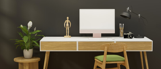 Home office desk with computer, stationery, camera and decorations in grey wall room, 3D rendering