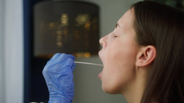 PCR test process, Doctor medical staff worker wearing protective equipment takes sample from throat of patient to antigen test for coronavirus, laboratory in airport terminal for tourists, protection