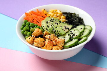 Delicious salad with chicken and vegetables on color background, closeup