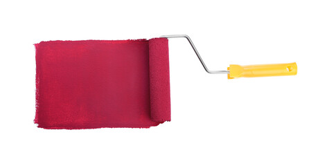 Applying burgundy paint with roller brush on white background, top view
