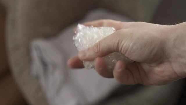 Clicking and bursting of bubble wrap due to nerves and to calm down
