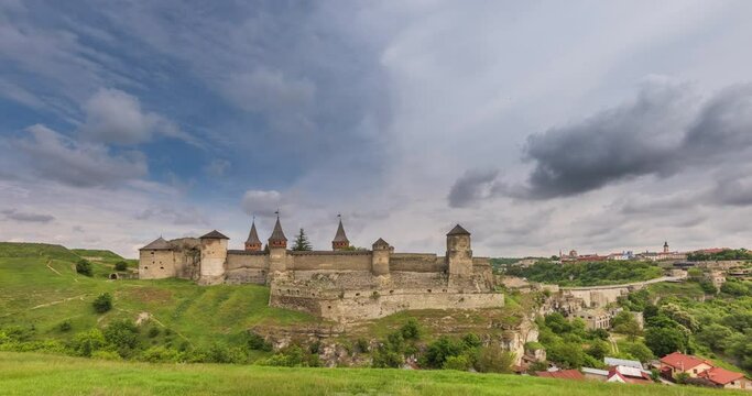 Time lapse of Sunset over the city of Kamianets-Podilskyi. Kamianets-Podilskyi Castle is the fortress located in the histori