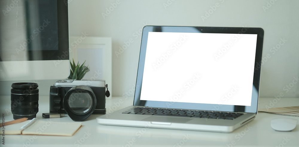 Poster mock up copy space blank screen workspace with computer laptop on table.