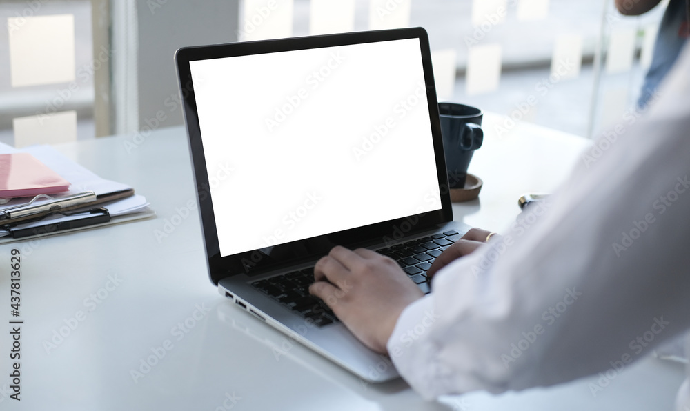 Poster mock up copy space blank screen workspace with computer laptop on table.