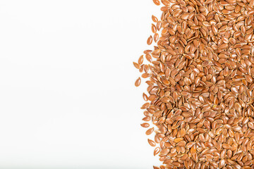 Close up of flax seeds, as background. White background. Top view. Macro photography.