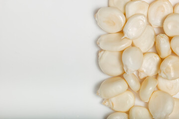 Dried maize mote on white background. Top view. Macro photography.