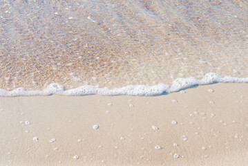 Soft wave of the sea on the sandy beach.Soft focus,blurred image.