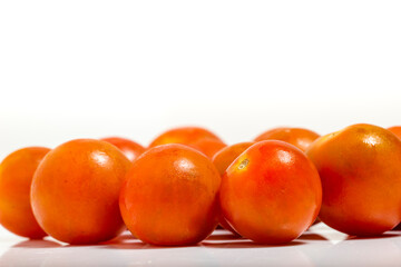 Tomato cherry isolated on white background. Macro photograpy