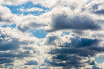Obraz premium White fluffy clouds in the blue sky background.Cloudy white blue sky in the nice blue heaven sky.