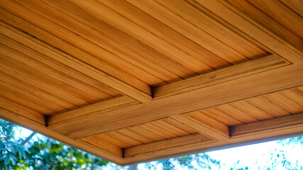The ceiling is made of natural colored teak.