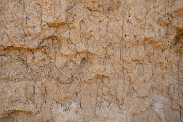 Brown clay wall. Clay surface texture, background for wallpaper.