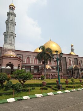 The top of the dome and the minaret of the gold dome of Depok, Indonesia