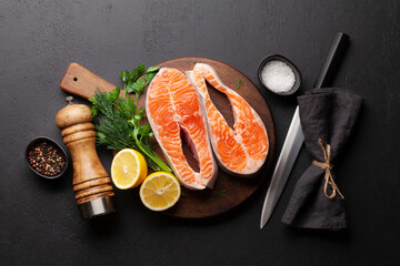 Fresh raw salmon cooking. Fish steaks with herbs
