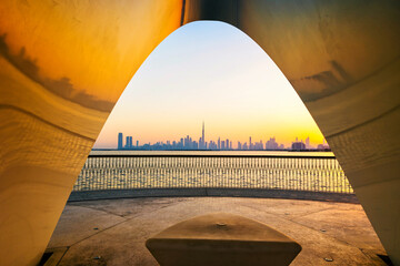 Dubai, UAE - June 2, 2021: Dubai city skyline at dusk or evening. A beautiful view from Dubai Creek...