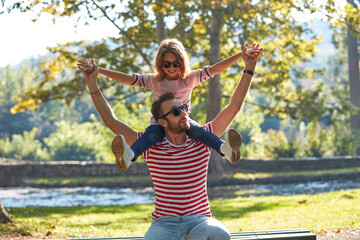 Fototapeta premium Single father and little daughter enjoying in the park.