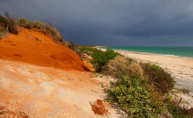 Strom clouds rolling in towards Bottle Bay beach at Francois Peron National Park at Shark Bay, Western Australia