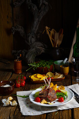 Lamb chops marinated in herbs with green asparagus and lime