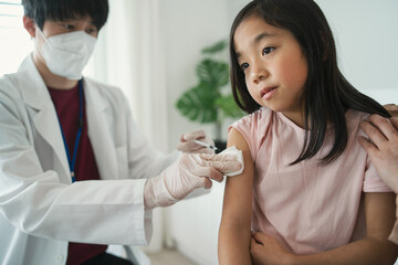 Vaccination of small child, coronavirus and covid-19 concept.