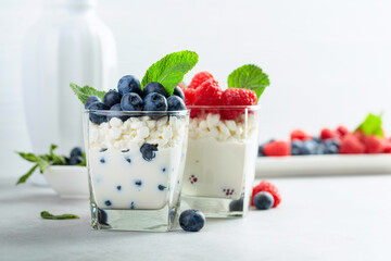 Curd dessert with berries and mint.