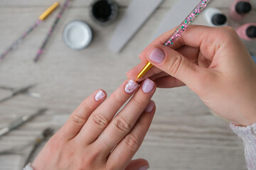Modern female nude design manicure. Nail care, Self care. Professional Hardware Manicure. Procedure...